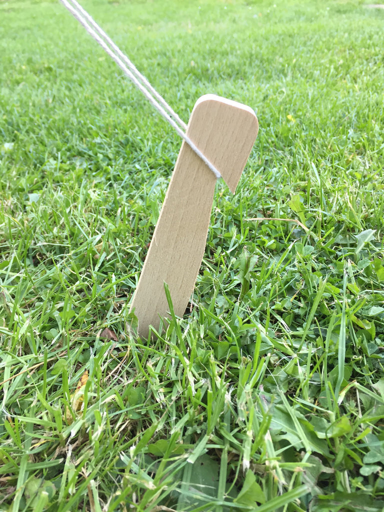 wooden tent and camping pegs