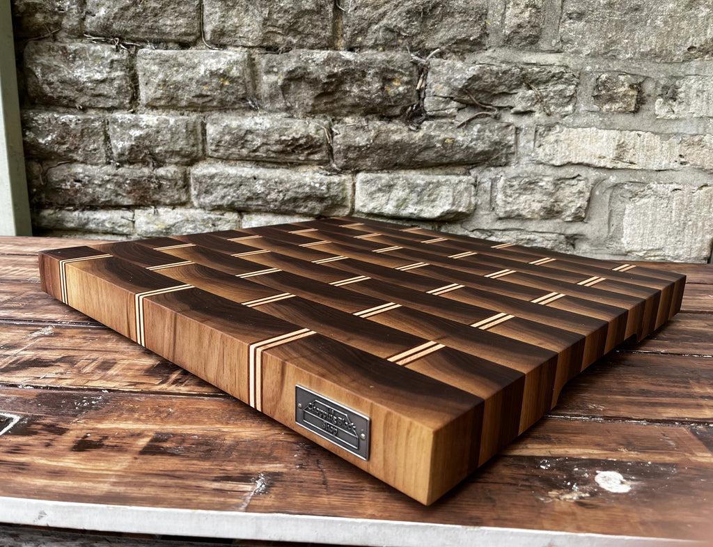 End grain board made by the chopping block shop with an engraved plaque