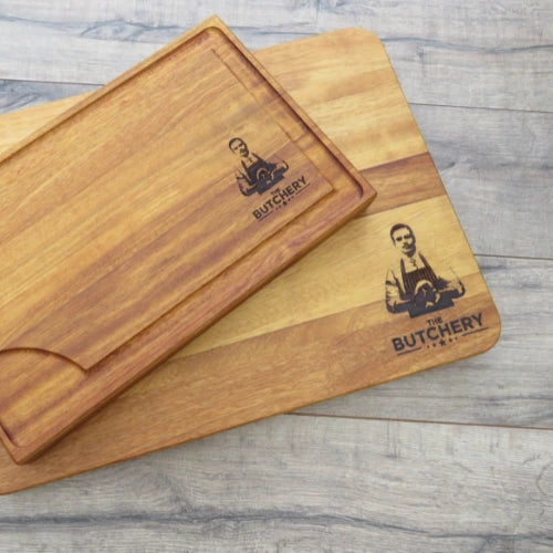 Engraved chopping board with a detailed image and text for The Butchery